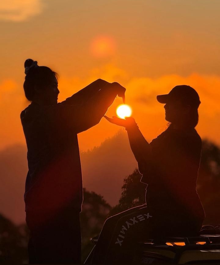 Happy tourists enjoying the 4x4 Jeep adventure at sunrise